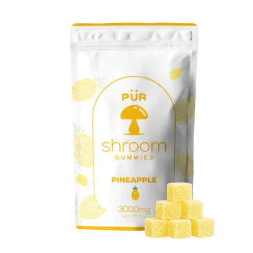 Pineapple Shroom Gummies front of pouch with gummies on display
